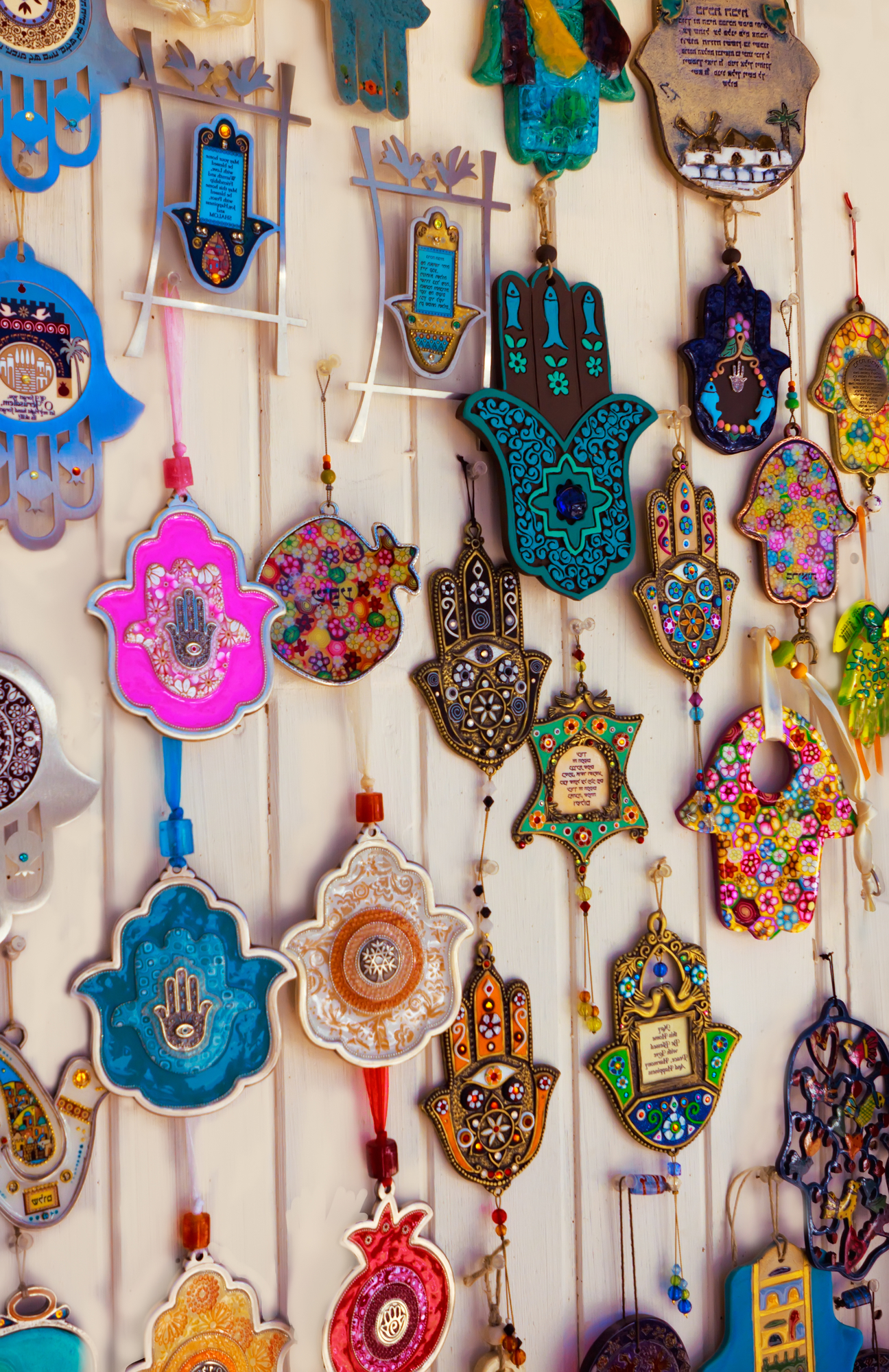 Different kind of remembrances and amulets (hamsa, pomegranate,